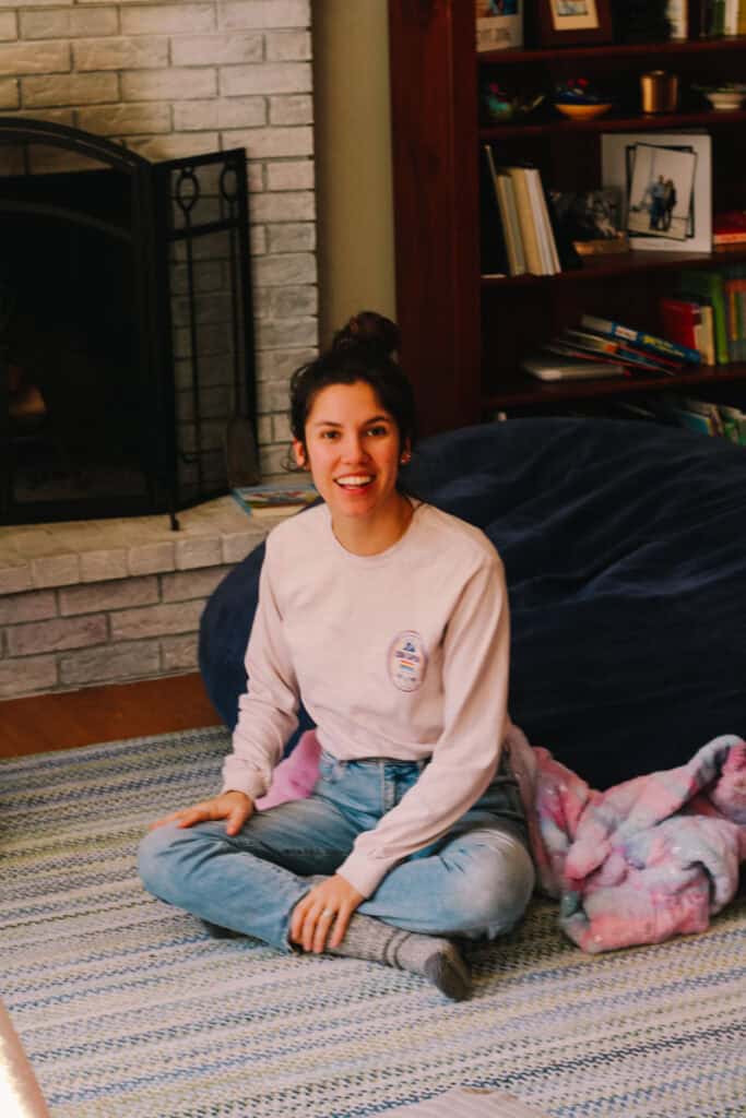 mother sitting on floor ready to play with kids