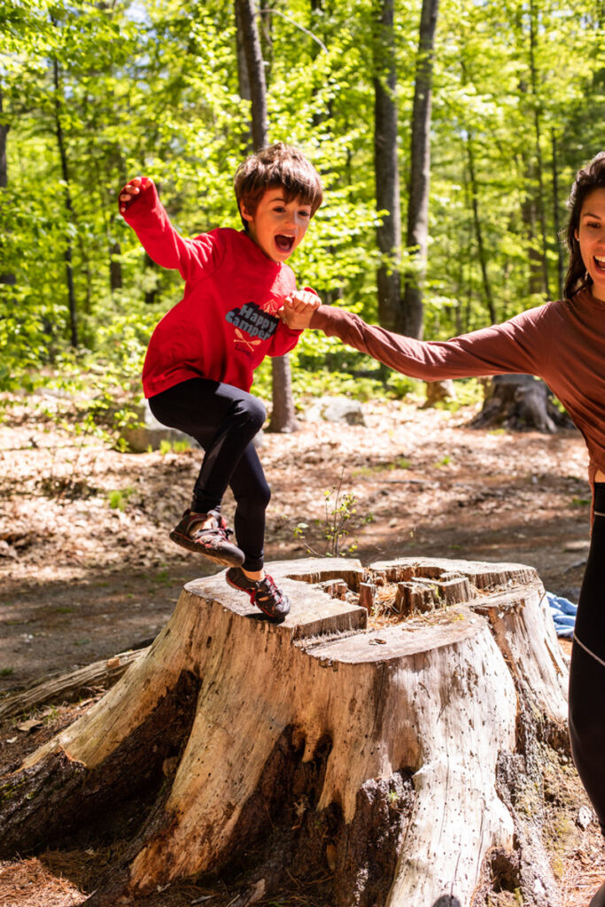 family exploring the campsite while on a camping trip
