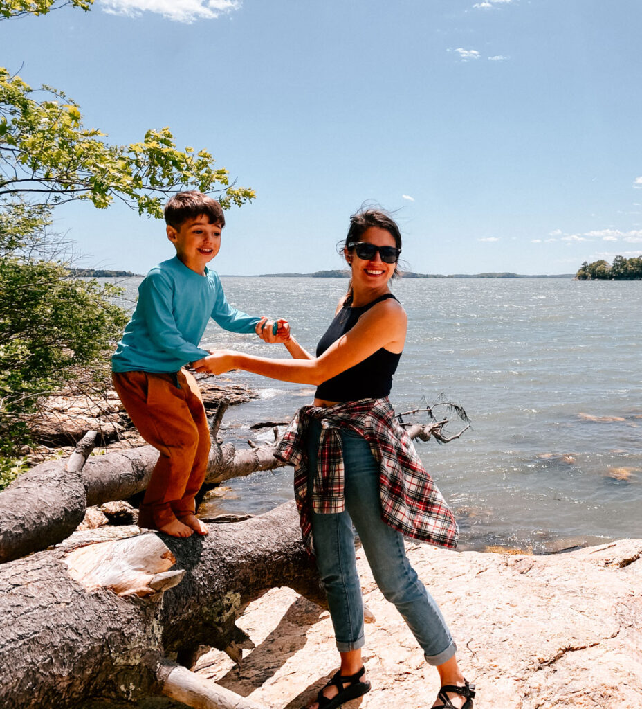 mom and son camping, mom showing her camping layers including a flannel shirt